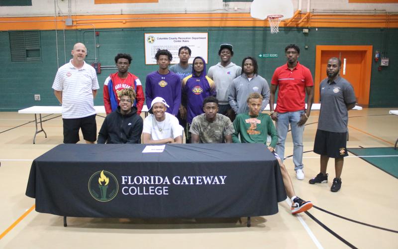 Columbia forward D'Andre Jefferson is pictured with the basketball team after signing his letter of intent Friday with FGC. (JORDAN KROEGER/Lake City Reporter)