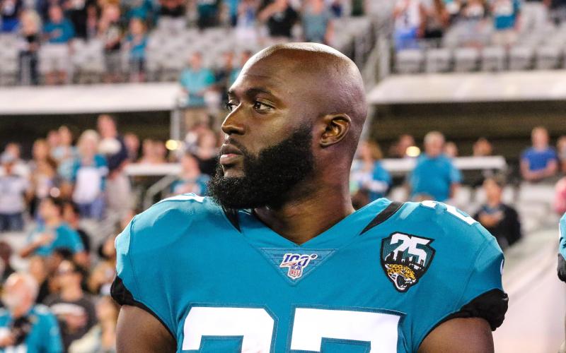 Jacksonville Jaguars running back Leonard Fournette (27) stands for the national anthem before a game against the Tennessee Titans at TIAA Bank Field on Sept. 19, 2019 in Jacksonville. (GARY LLOYD MCCULLOUGH/TNS)