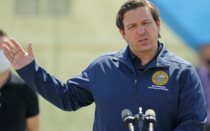 Florida Governor Ron DeSantis talks to the media during press conference to announces covid-19 antibody testing, mobile lab at Hard Rock Stadium as the novel coronavirus pandemic continues on May 6, in Miami Gardens. (DAVID SANTIAGO/Miami Herald/TNS)