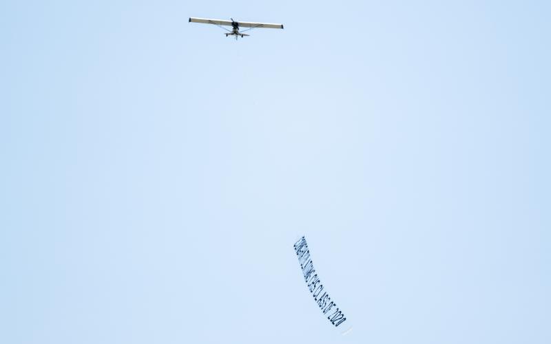 A plane carrying good wishes for Columbia High seniors flies over Lake City on Tuesday. (RAY CARPENTER PHOTOGRAPHY/Special to the Reporter)