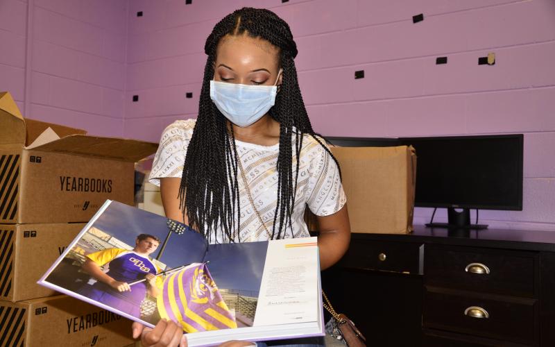 Columbia editor-in-chief Anan-Eya Hardman holds in her hands the culmination of a months-long collaborative effort. (CARL MCKINNEY/Lake City Reporter)