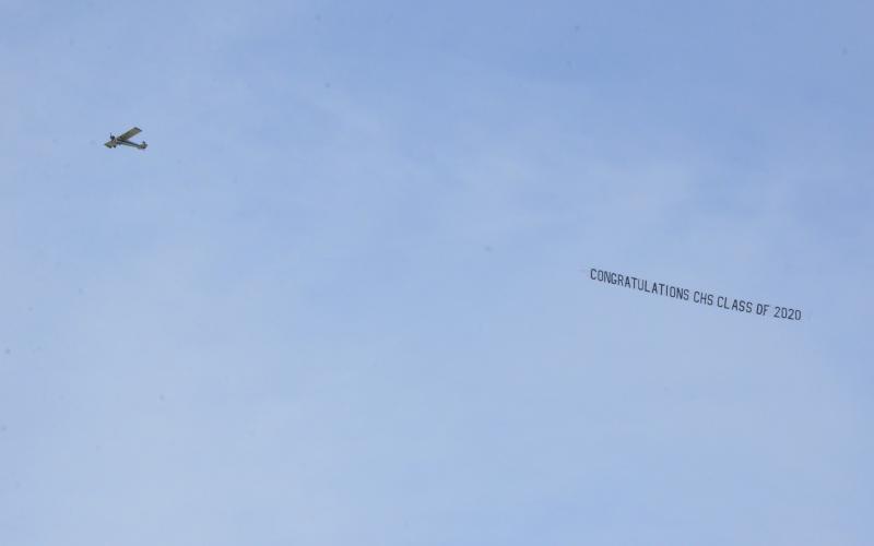 For about an hour Tuesday afternoon, a plane flew over the school, downtown and the U.S. Highway 90 corridor to display the message, “Congratulations CHS Class of 2020.”  The plane flies over CHS before continuing its circuit. The pandemic threw a wrench into seniors’ prom and graduation plans, so the school says it wanted to make a gesture showing the students were not forgotten. (CARL MCKINNEY/Lake City Reporter)