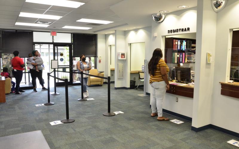 Students register for fall classes at Florida Gateway College. The spring graduates haven’t been forgotten, as the college is planning a gauntlet of small-scale ceremonies to give everyone their chance to walk. (CARL MCKINNEY/Lake City Reporter)