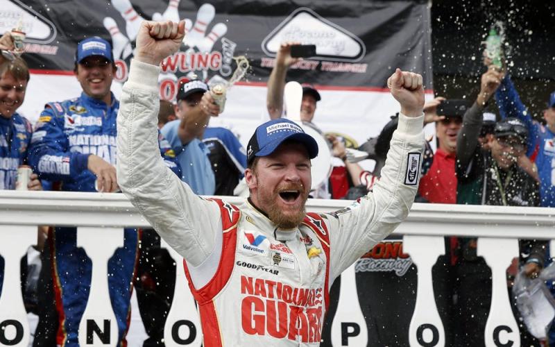 Dale Earnhardt Jr. celebrates in Victory Lane after winning a NASCAR Sprint Cup Series auto race at Pocono Raceway on Aug. 3, 2014, in Long Pond, Pa. (AP FILE PHOTO)