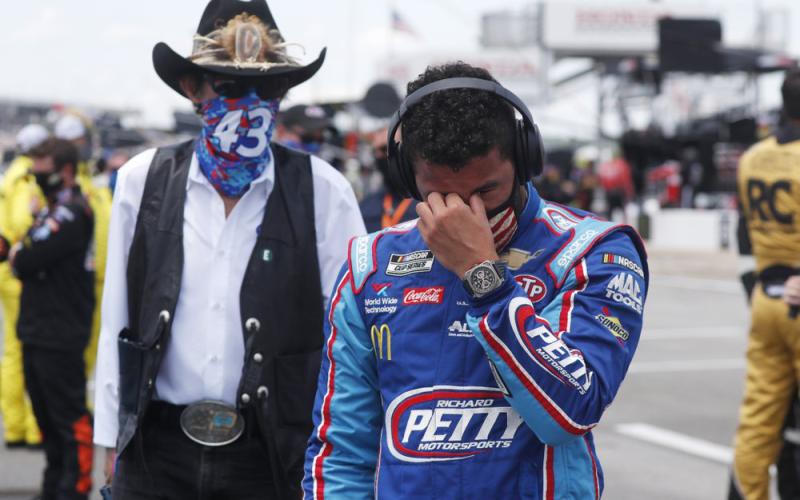 Driver Bubba Wallace, right, is overcome with emotion as he and team owner Richard Petty walk to his car in the pits of the Talladega Superspeedway prior to the start of the NASCAR Cup Series auto race at the Talladega Superspeedway on Monday, in Talladega Ala. (JOHN BAZEMORE/AP Photo)