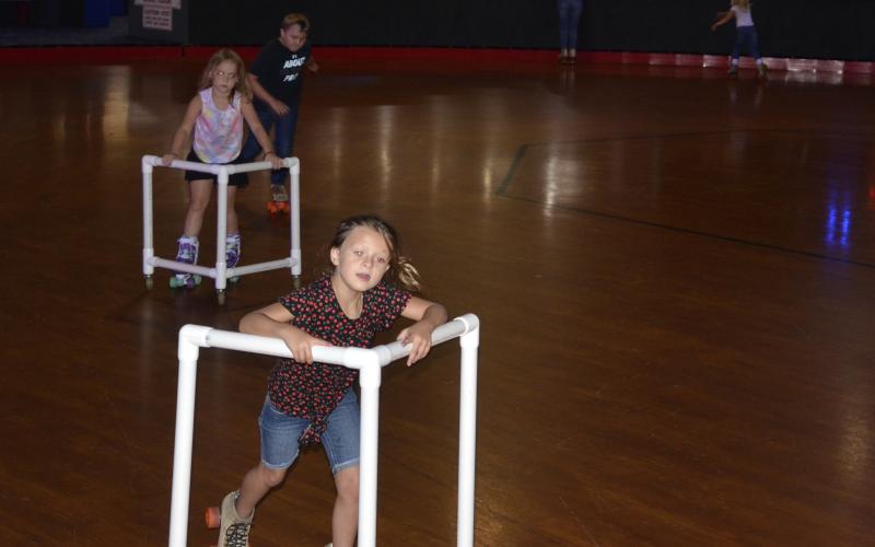 Children skate during a daycare field trip to Skating Palace on Tuesday afternoon. The local skating rink says business is starting to ramp back up, and expects to see an increased volume of customers next week. (CARL MCKINNEY/Lake City Reporter)