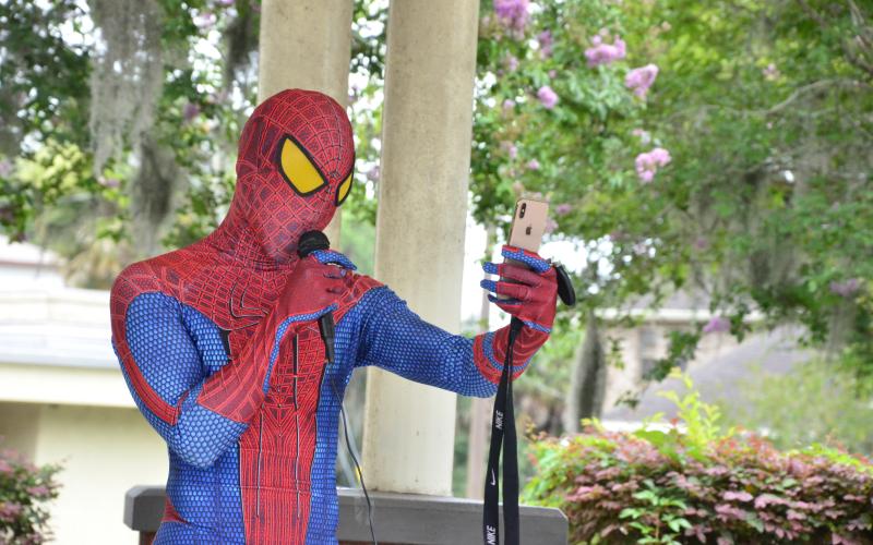 Todd Franklin dons a Spider-Man costume while calling on Americans to make a stand against systemic racism. Franklin, one of the organizers of the Black Lives Matter rally, wore the same outfit during a similar demonstration earlier in the week. (CARL MCKINNEY/Lake City Reporter)