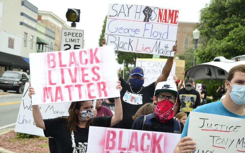 Protestors chant as they march for racial justiPeople of all age groups and backgrounds participated in the demonstration. (CARL MCKINNEY/Lake City Reporter)