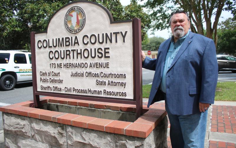 P. DeWitt Cason, who has served as the Columbia County Clerk of Circuit Court and Comptroller for 32 years, stands outside the Columbia County Courthouse on Wednesday afternoon. Cason recently submitted his resignation papers to Gov. Ron DeSantis with plans to leave office 2 p.m. Aug. 14. (TONY BRITT/Lake City Reporter)