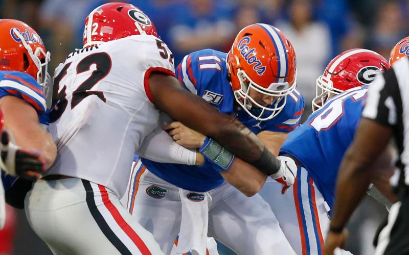 Florida quarterback Kyle Trask is sacked in last year's game against Georgia. (TAMPA BAY TIMES/TNS)