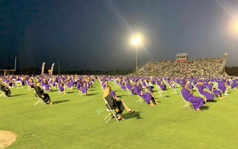 The Columbia High Class of 2020 complied with social distancing, sitting 6 feet apart Saturday night for commencement and some students didn’t attend. (RAY CARPENTER/Lake City Reporter)