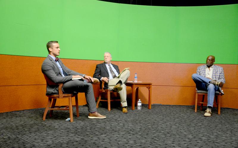 Noah Walker, left, and Jake Hill, candidates for the Lake City Council District 12 seat, discussed expanding the city’s utilities during the candidate forum Thursday night. (CARL MCKINNEY/Lake City Reporter)