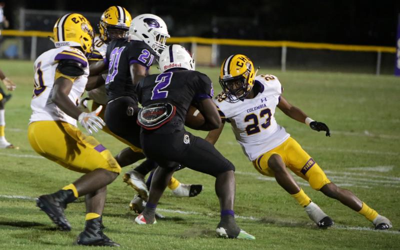 Columbia safety Dante Brown moves in to make a tackle during last year’s game against Gainesville. (BRENT KUYKENDALL/Lake City Reporter)