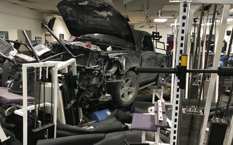 A truck sits in the middle of Branford Fitness and Tanning after ramming into the gym late Monday night. Nobody was injured in the crash. (COURTESY BILL PROCKO)