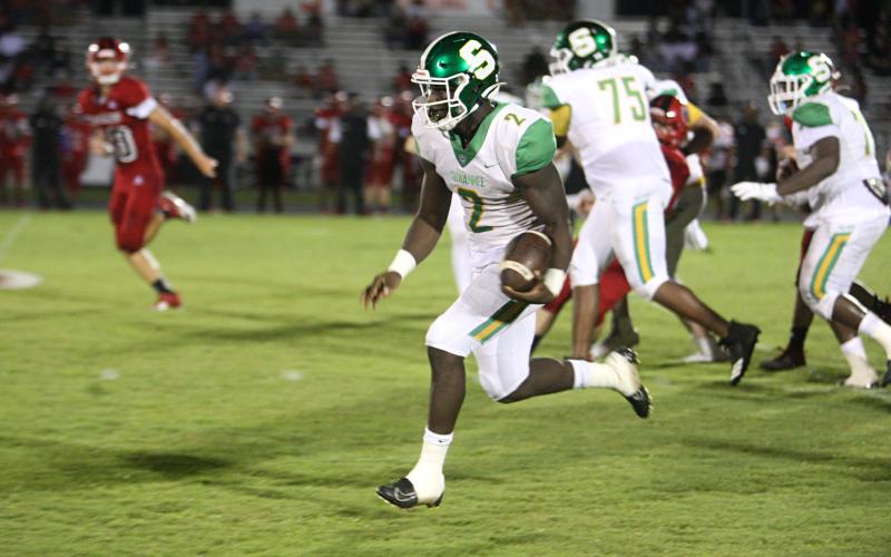 Suwannee quarterback Jaquez Moore scrambles up the field against Hamilton County last Friday. (PAUL BUCHANAN/Special to the Reporter)