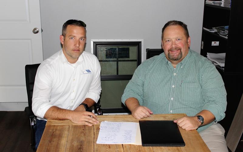 Columbia Builder’s Association President Isaiah Cully (left) and Lake City Reporter Publisher Todd Wilson discuss this year’s Parade of Homes, which is scheduled for the weekend of October 24-25. (BRYAN ZECHER/Special to the Reporter)
