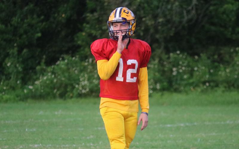 Columbia quarterback Ty Wehinger calls out to a receiver during Tuesday’s practice. (JORDAN KROEGER/Lake City Reporter)