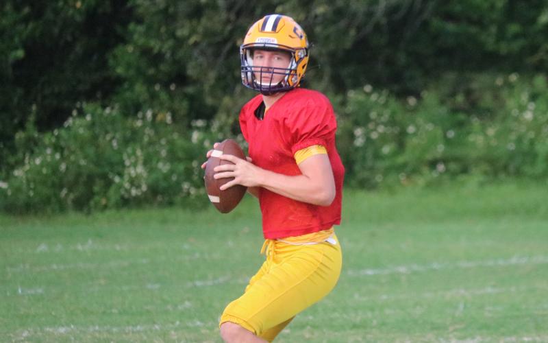 Columbia quarterback Kade Jackson drops back to pass during Tuesday’s practice. (JORDAN KROEGER/Lake City Reporter)