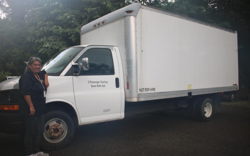 Annette Martin, Lake City-Columbia County Humane Society intake coordinator, stands next to a 2008 GMC box truck that was donated to the agency earlier this week. (TONY BRITT/Lake City Reporter)