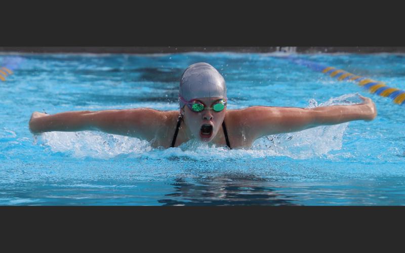 Kaydence Clark competes in the 100 butterfly. (SHELBY CONKLIN/Special to the Reporter)