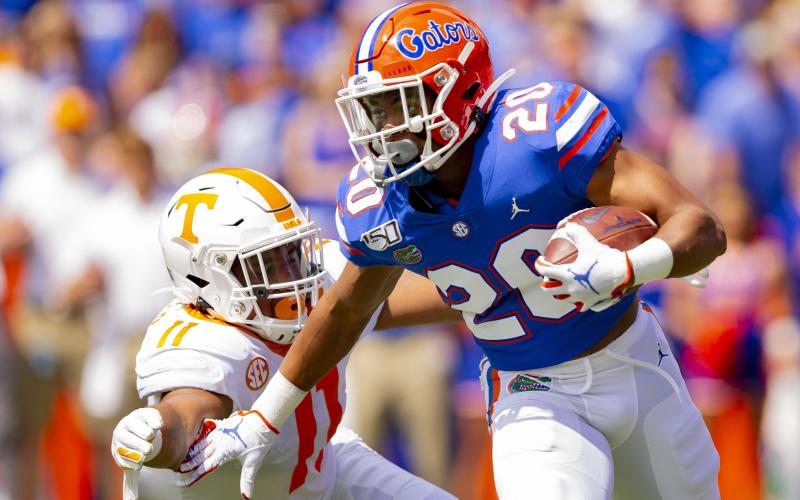 Florida Gators running back Malik Davis, right, carries the ball up the field against Tennessee last season. (CARMEN MANDATO/Getty Images/TNS)