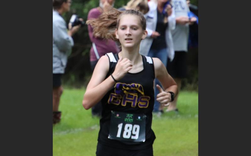 Columbia’s Audrey Fender runs during Saturday’s 12th Annual Alligator Lake Invitational. (SHELBY CONKLIN/Lake City Reporter)
