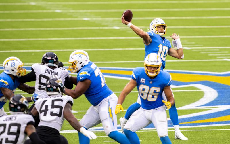 Los Angeles Chargers quarterback Justin Herbert (10) throws a 70-yard touchdown pass to wide receiver Jalen Guyton in the third quarter against the Jacksonville Jaguars at SoFi Stadium on Sunday in Inglewood, California. (ALLEN J. SCHABEN/Los Angeles Times/TNS)