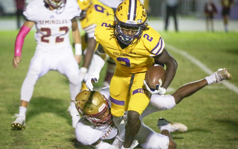 Columbia receiver Jaden Williams escapes a tackle from a Florida High defender last Friday. (BRENT KUYKENDALL/Lake City Reporter)