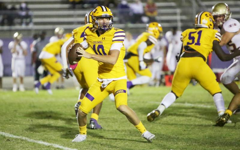 Columbia quarterback Kade Jackson drops back to pass against Florida High on Friday night. (BRENT KUYKENDALL/Lake City Reporter)