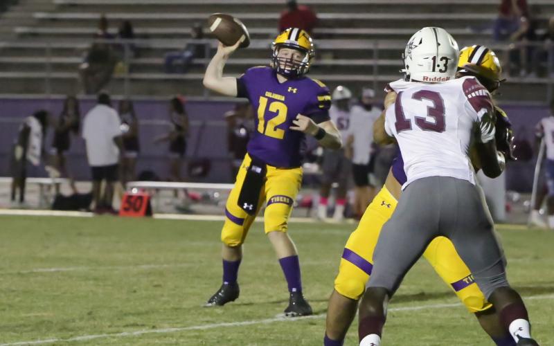 Columbia quarterback Ty Wehinger unloads a pass against Madison County on Friday. (BRENT KUYKENDALL/Lake City Reporter)
