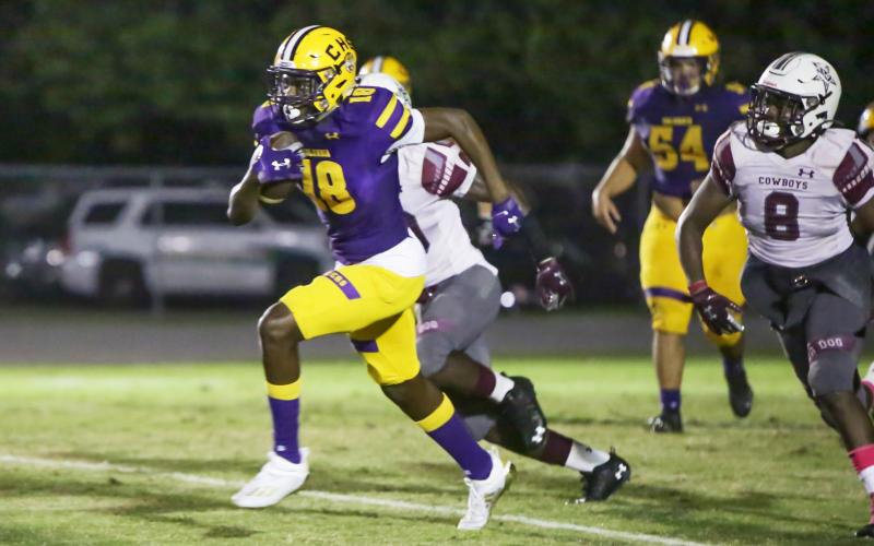 Columbia’s Marcus Peterson picks up a first down on a fake punt last week against Madison County. (BRENT KUYKENDALL/Lake City Reporter)