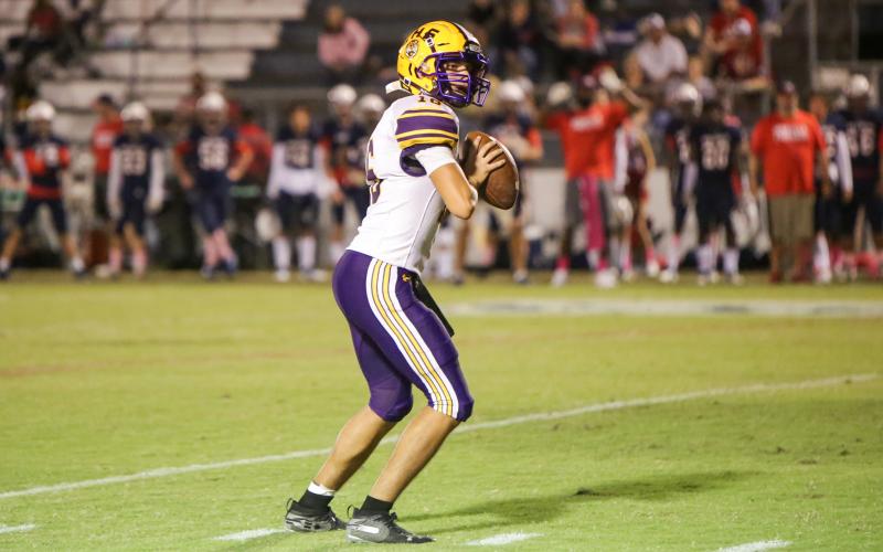 Columbia quarterback Bronsen Tillotson drops back to pass against Wakulla last Friday. (BRENT KUYKENDALL/Lake City Reporter)