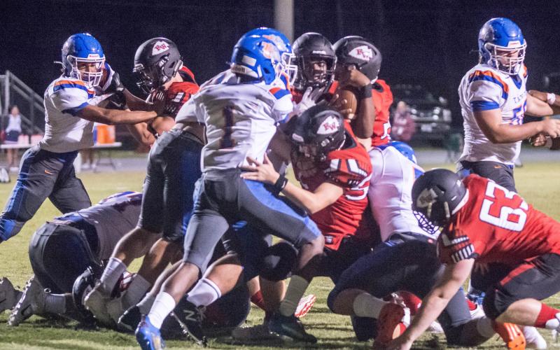 Fort White quarterback Tyler Jefferson fights to gain yardage against Taylor County on Oct. 2. (CHRISTINA FEAGIN/Special to the Reporter)