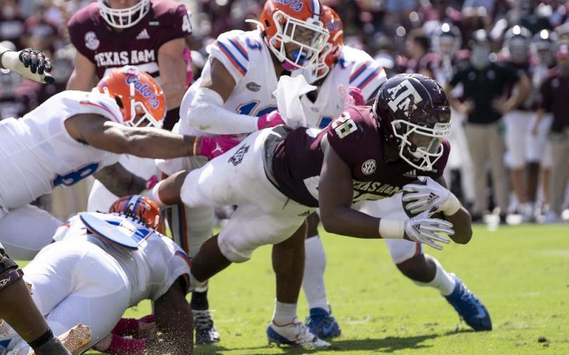Texas A&amp;M running back Isaiah Spiller (28) dives over the goal line for a touchdown against Florida on Saturday in College Station, Texas. (SAM CRAFT/Associated Press)