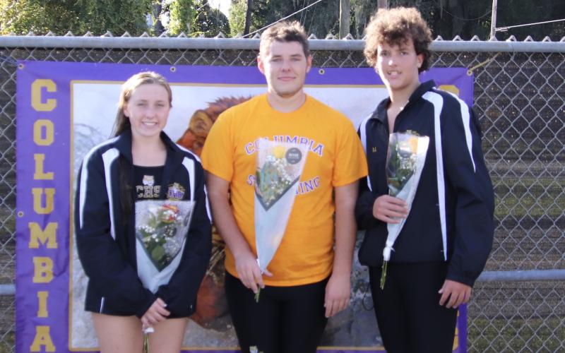 Columbia swimmers Mackenzie Conklin, Alex Jewett and R.J. Dutch were honored on Senior Night during Tuesday’s meet against Suwannee. (SHELBY CONKLIN/Special to the Reporter)