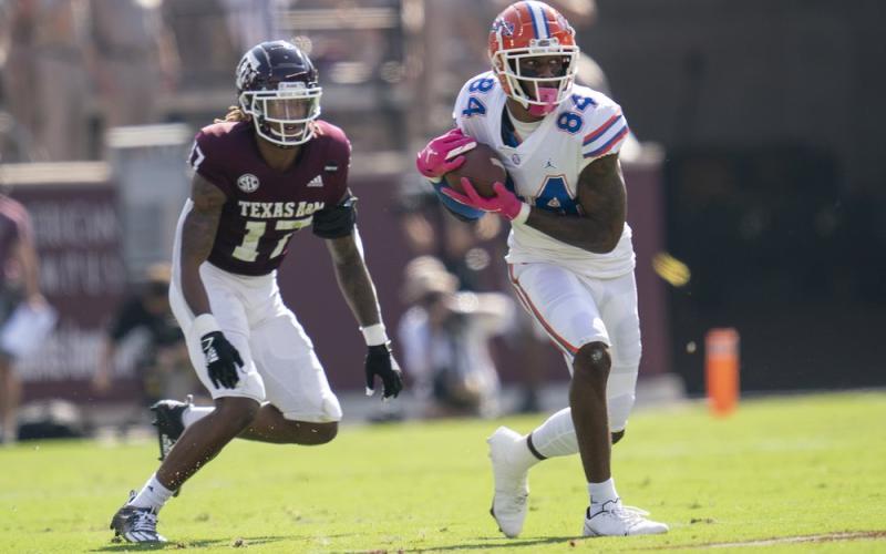 Florida tight end Kyle Pitts (84) catches a pass as Texas A&amp;M defensive back Jaylon Jones (17) defends on Saturday in College Station, Texas. SAM CRAFT/Associated Press)