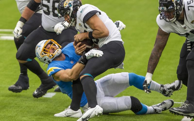 Chargers defensive end Joey Bosa assists in sacking Jaguars quarterback Gardner Minshew II on Oct. 25 in Inglewood, CA. Chargers beat the Jaguars 39-29. (ALLEN J. SCHABEN/Los Angeles Times/TNS)