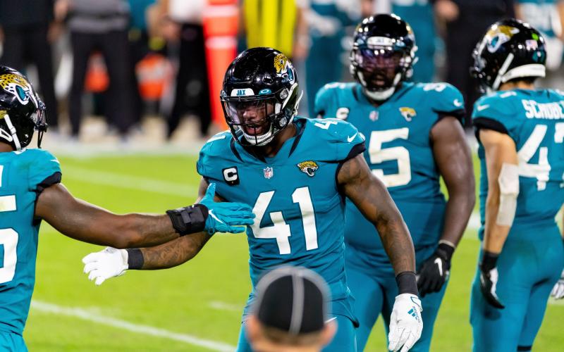 Jacksonville Jaguars defensive end Josh Allen celebrates a sack on Miami Dolphins quarterback Ryan Fitzpatrick at TIAA Bank Field on Sept. 24 in Jacksonville. (TRIBUNE NEWS SERVICE)