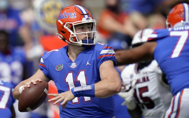 Florida quarterback Kyle Trask (11) throws a pass against South Carolina on Saturday in Gainesville. (JOHN RAOUX/Associated Press)