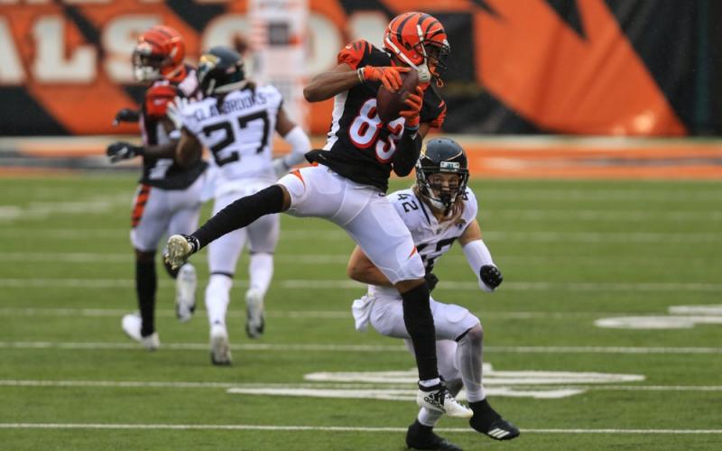 Cincinnati Bengals wide receiver Tyler Boyd (83) makes a catch in front of Jacksonville Jaguars free safety Andrew Wingard (42) on Sunday, in Cincinnati. (AARON DOSTER/Associated Press)