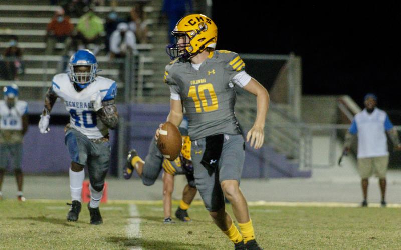Columbia quarterback Kade Jackson looks to pass against Lee on Friday night. (RAY CARPENTER PHOTOGRAPHY)
