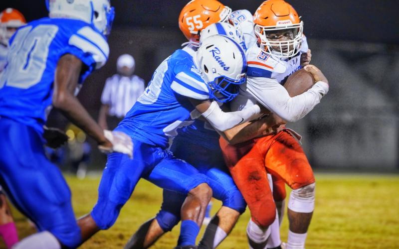 Branford running back Markell Pugh powers through an Interlachen defender Friday night. (BRIAN LEWIS/Special to the Reporter)