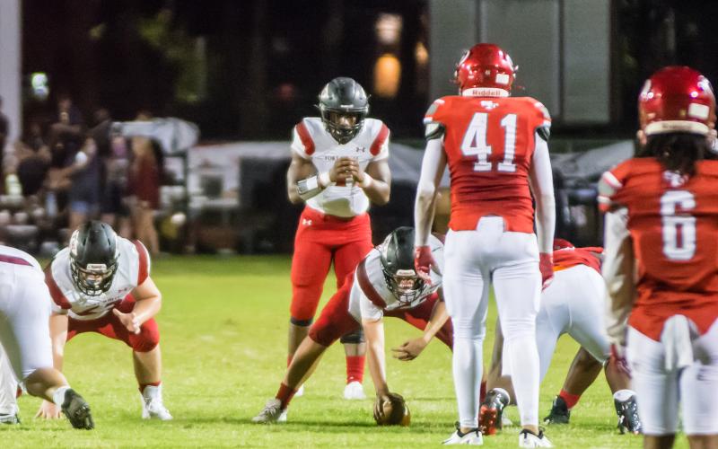 Fort White quarterback Tyler Jefferson gets set to take a snap against Santa Fe on Sept. 18. (CHRISTINA FEAGIN/Special to the Reporter)