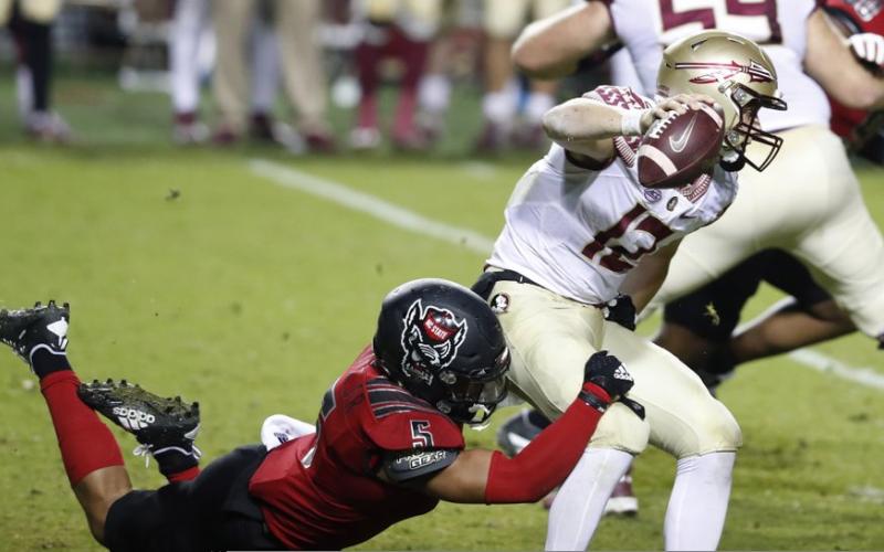 North Carolina State linebacker C.J. Hart Jr. (5) sacks Florida State quarterback Chubba Purdy (12) on Nov. 14 in Raleigh, N.C. (ETHAN HYMAN/The News &amp; Observer via AP, Pool)