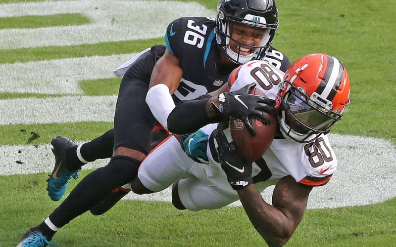 Cleveland Browns wide receiver Jarvis Landry hauls in a touchdown reception defended by Jacksonville Jaguars cornerback Luq Barcoo at TIAA Bank Field on Sunday in Jacksonville. (JOHN KUNTZ, cleveland.com/TNS)