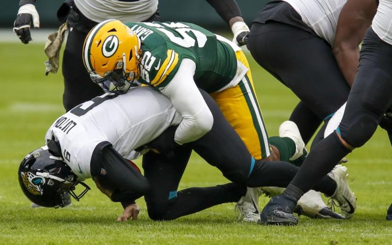 Jacksonville Jaguars' Jake Luton is sacked by Green Bay Packers' Rashan Gary Sunday in Green Bay, Wis. The Packers won 24-20. (MATT LUDTKE/Associated Press)