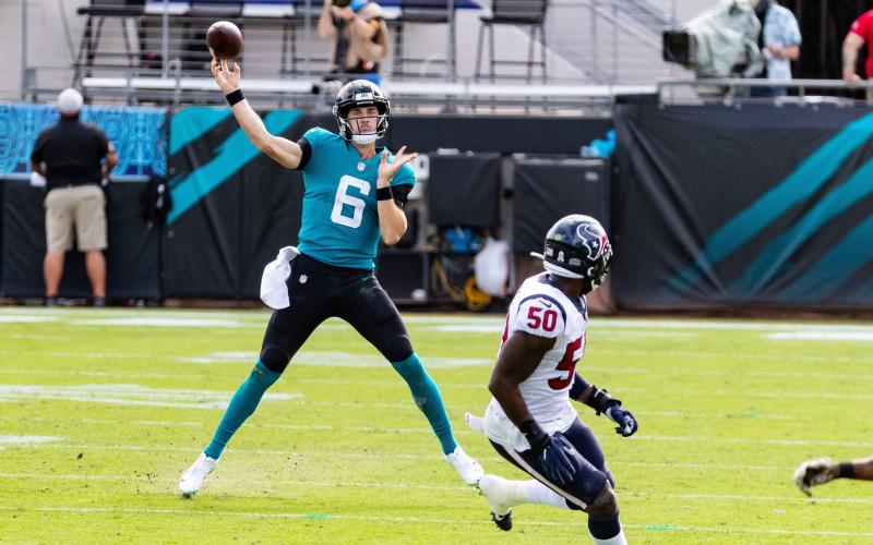 Jacksonville Jaguars quarterback Jake Luton (6) passes on the run in the first quarter against the Texans. (MATT PENDLETON/TNS)