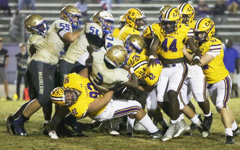Columbia defensive lineman Nate Walmsley tackles Daytona Beach Mainland quarterback Theodore Lockley during Friday’s Region 1-6A semifinal. (BRENT KUYKENDALL/Lake City Reporter)