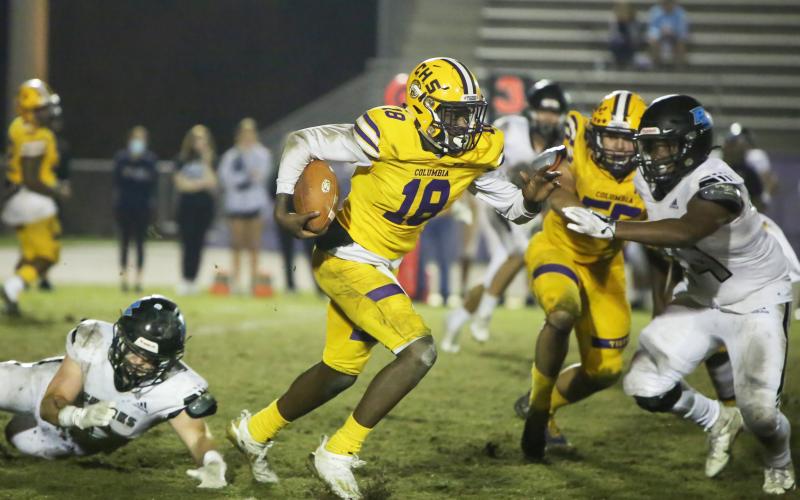 Columbia quarterback Marcus Peterson scrambles up the field against Ponte Vedra during last Friday's Region 1-6A playoff game. (BRENT KUYKENDALL/Lake City Reporter)