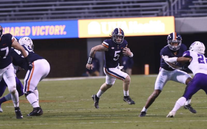 Virginia quarterback Brennan Armstrong (5) runs the ball against Abilene Christian on Nov. 21 in Charlottesville, Va. (ERIN EDGERTON/The Daily Progress via AP)